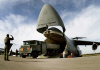 C-5 Unloads Cargo (USAF Photo)